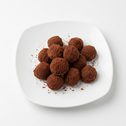 Cinnamon sugar donut holes on a white plate