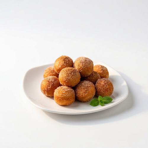 Cinnamon sugar donut holes on white background